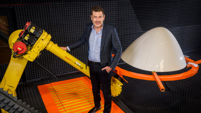 Justin Struik inside the Aerobond robotics transmissivity test room for the manufacturing and repairing of radomes